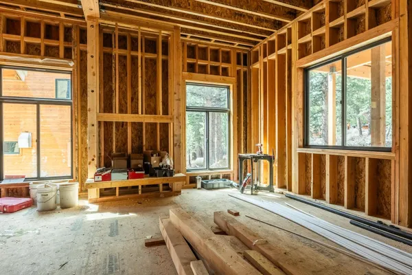 a view of a lush green hillside and a building