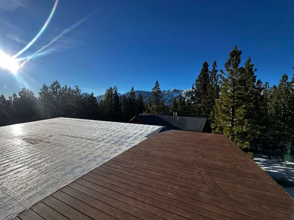 a view of a brick house with a large window