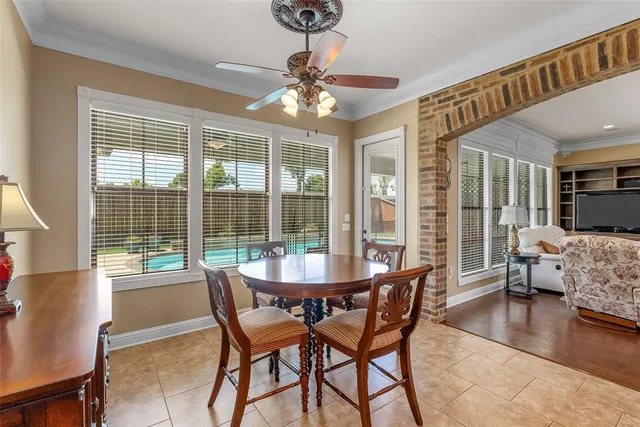 a dining room with furniture wooden floor and chandelier