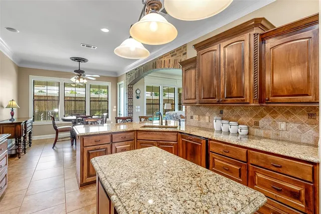 a large kitchen with kitchen island a large island in the center