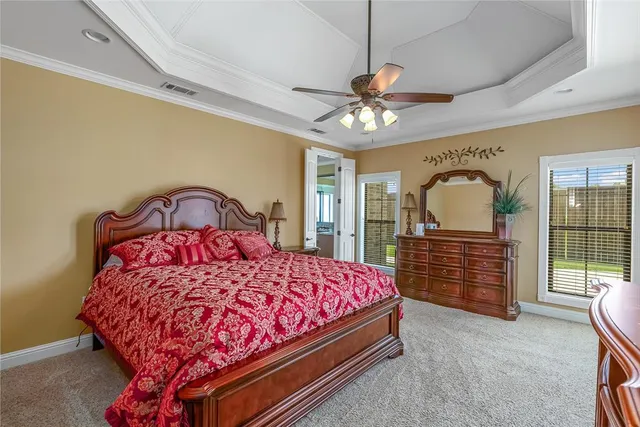 a bedroom with a bed dresser and a window