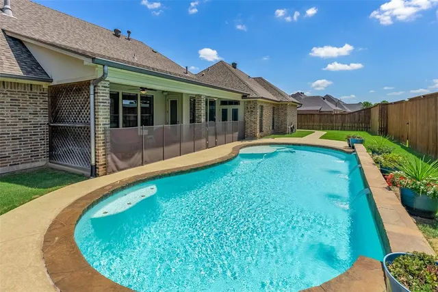 a view of a house with swimming pool