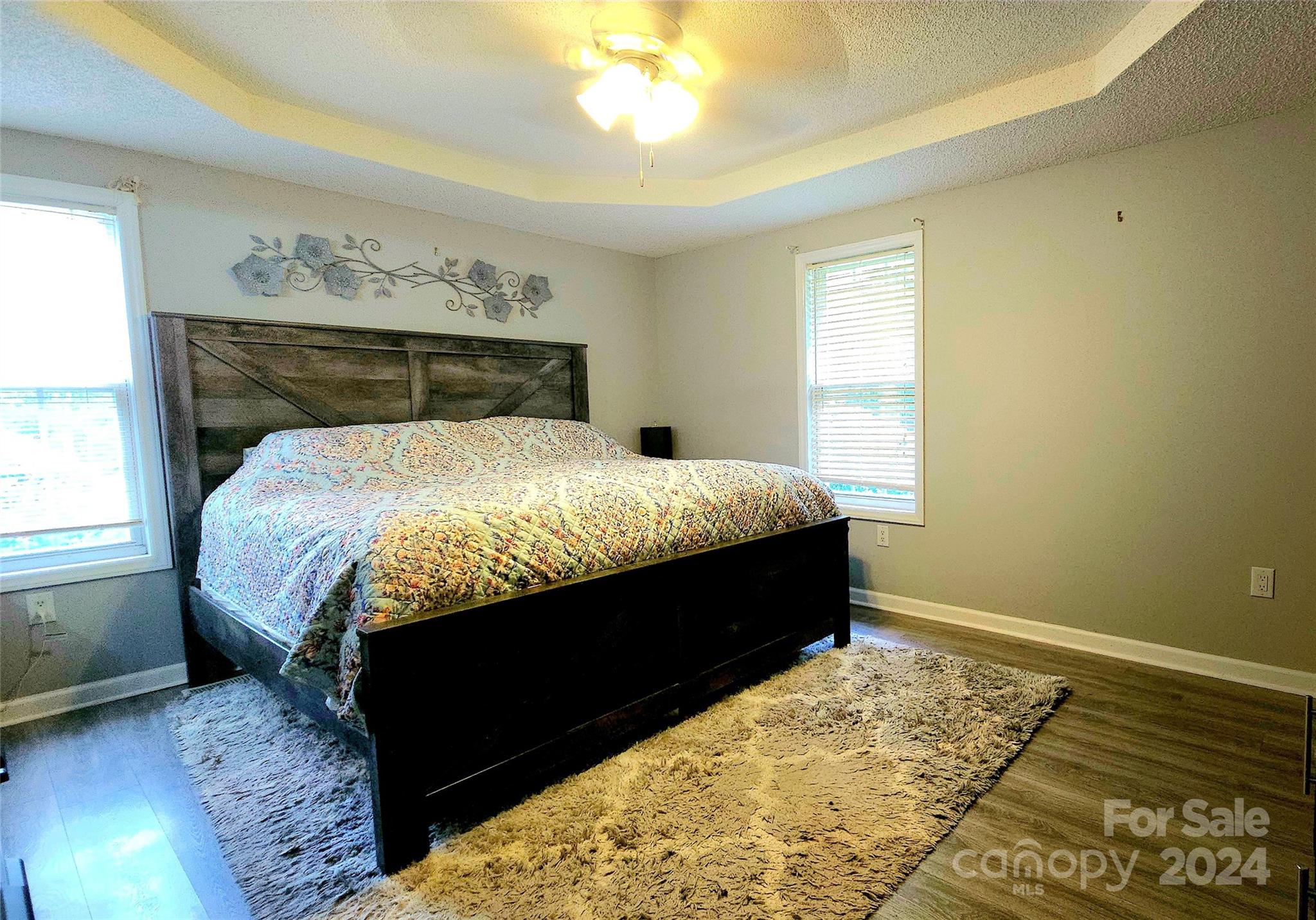 5013 Medlin Road Monroe, NC 28112 - Photo 17 of 30 a bed sitting in a bedroom next to a window