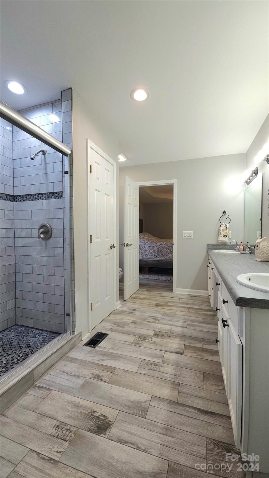 5013 Medlin Road Monroe, NC 28112 - Photo 18 of 30 a spacious bathroom with a shower and a sink