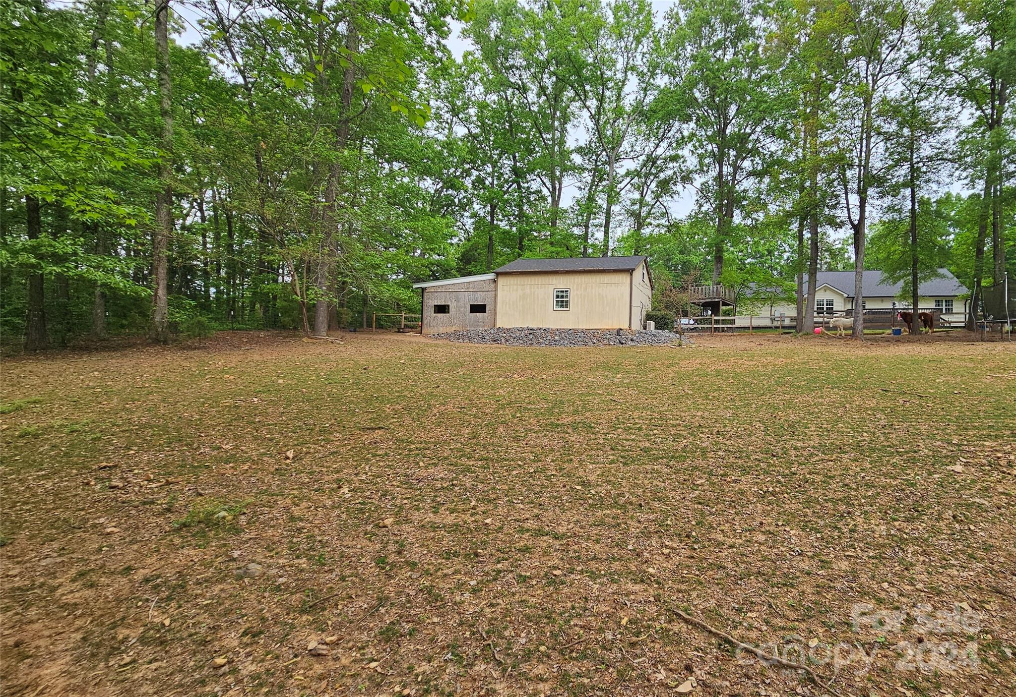 5013 Medlin Road Monroe, NC 28112 - Photo 25 of 30 a view of a tree in a yard