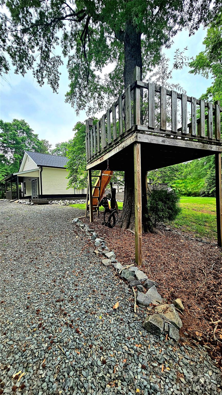 5013 Medlin Road Monroe, NC 28112 - Photo 26 of 30 a view of a house with backyard and sitting area