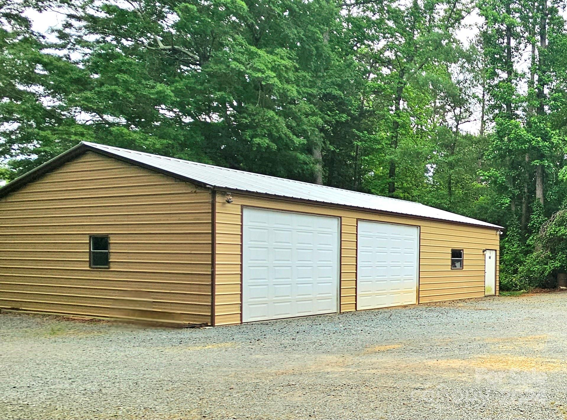 5013 Medlin Road Monroe, NC 28112 - Photo 29 of 30 a view of a house with a garage