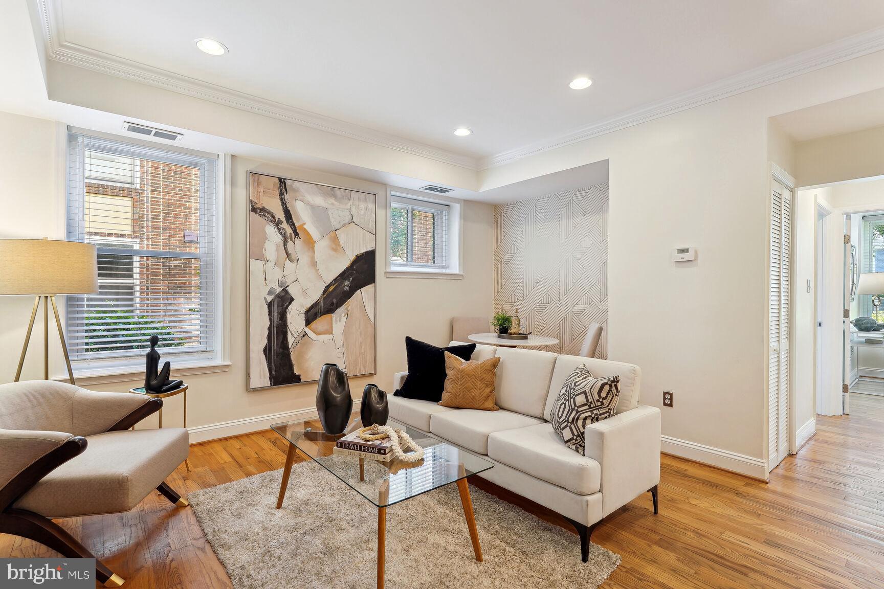 Light filled living room with designer wall paper!