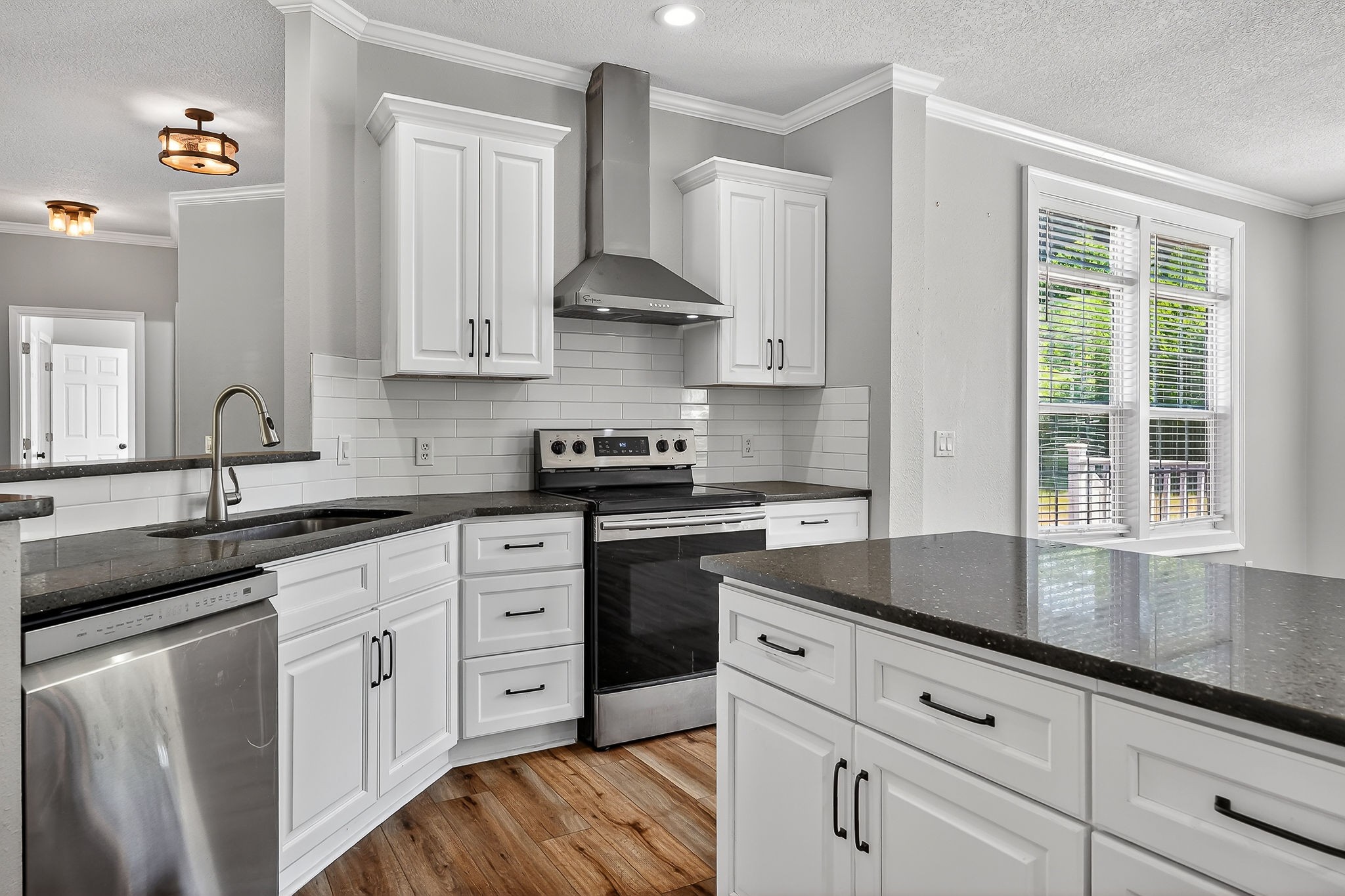 16062 Buffalo Valley Road Silver Point, TN 38582 - Photo 10 of 27 a kitchen with white cabinets white appliances and sink