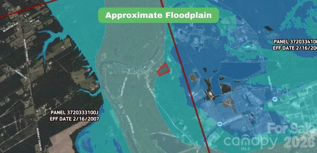 a sign on the wall next to a road