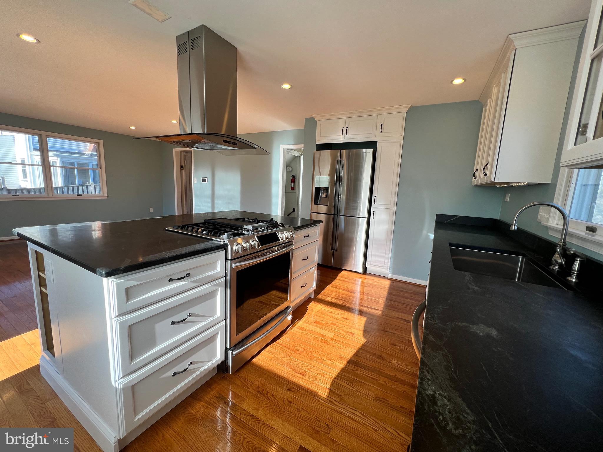318 Whitestone Road Silver Spring, MD 20901 - Photo 12 of 23 a kitchen with granite countertop a refrigerator stove and sink