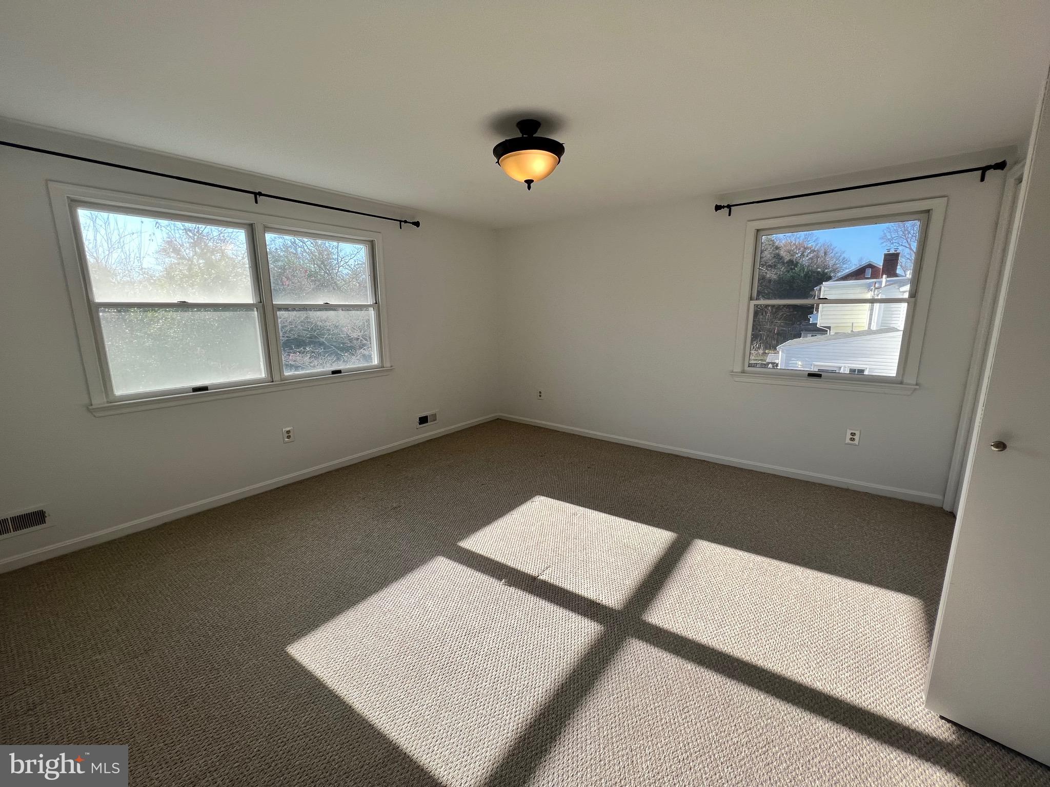 318 Whitestone Road Silver Spring, MD 20901 - Photo 18 of 23 an empty room with a window