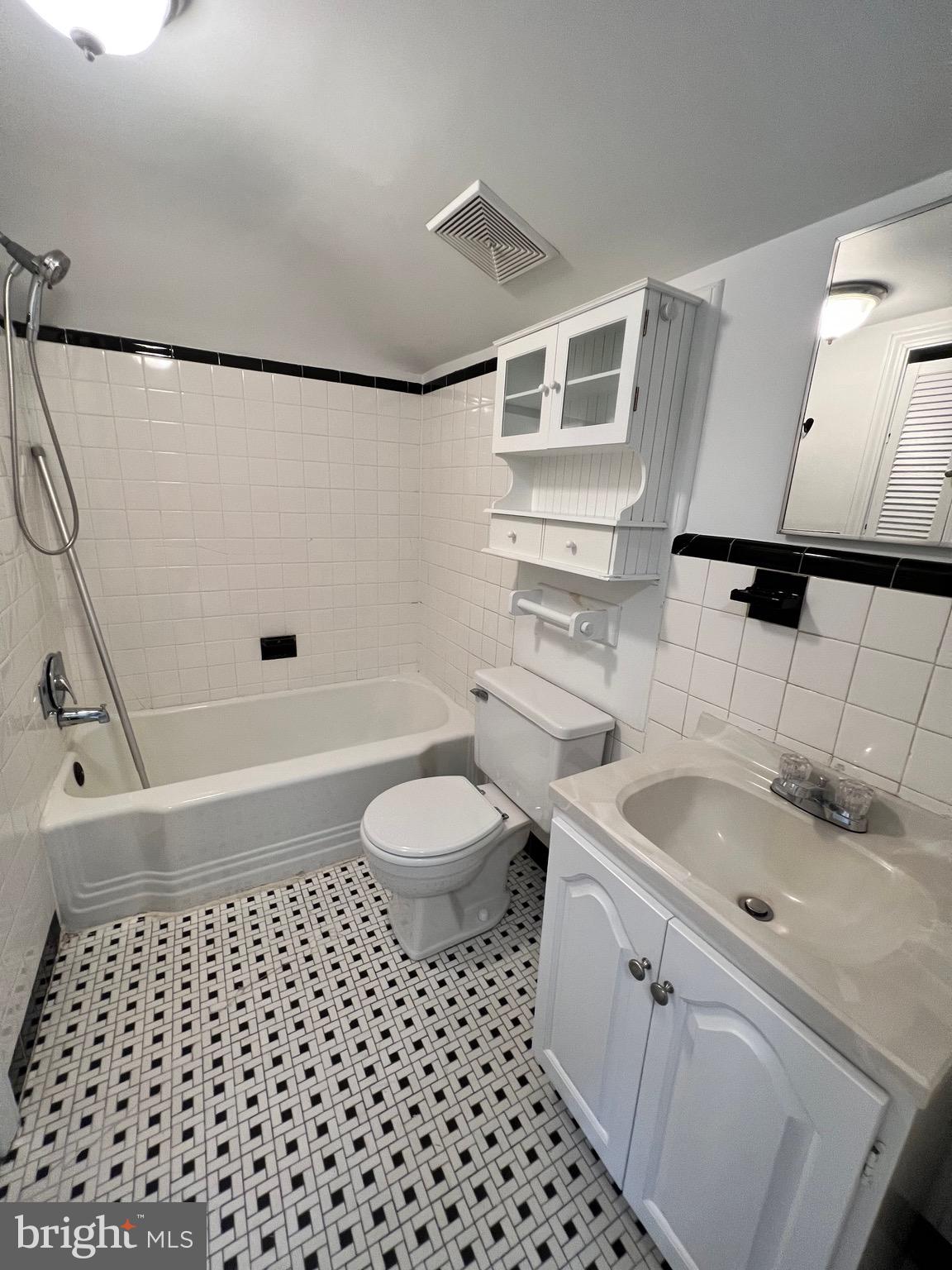 318 Whitestone Road Silver Spring, MD 20901 - Photo 19 of 23 a bathroom with a sink a toilet and shower