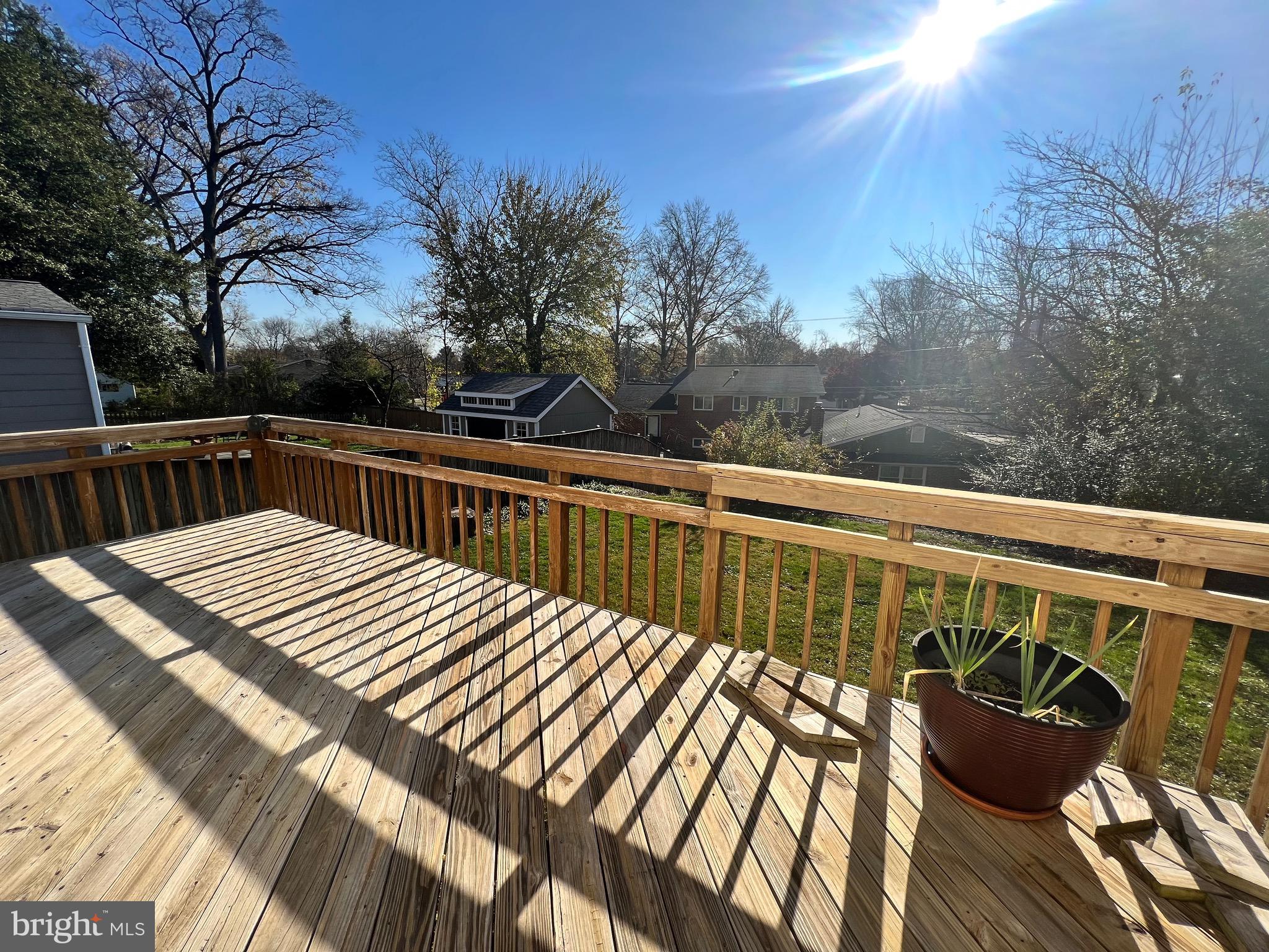 318 Whitestone Road Silver Spring, MD 20901 - Photo 7 of 23 a view of balcony with wooden floor and outdoor seating