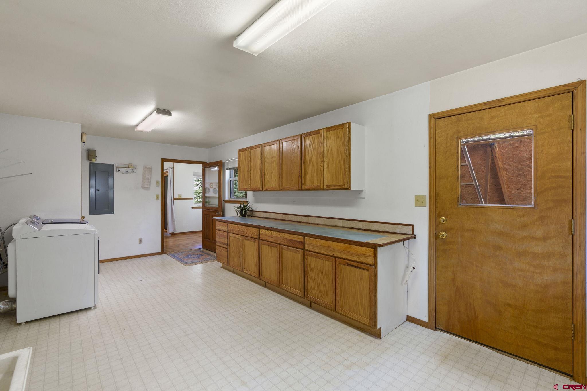 37 Verde Lane Durango, CO 81301 - Photo 42 of 45 a kitchen with stainless steel appliances granite countertop a stove a sink and a refrigerator