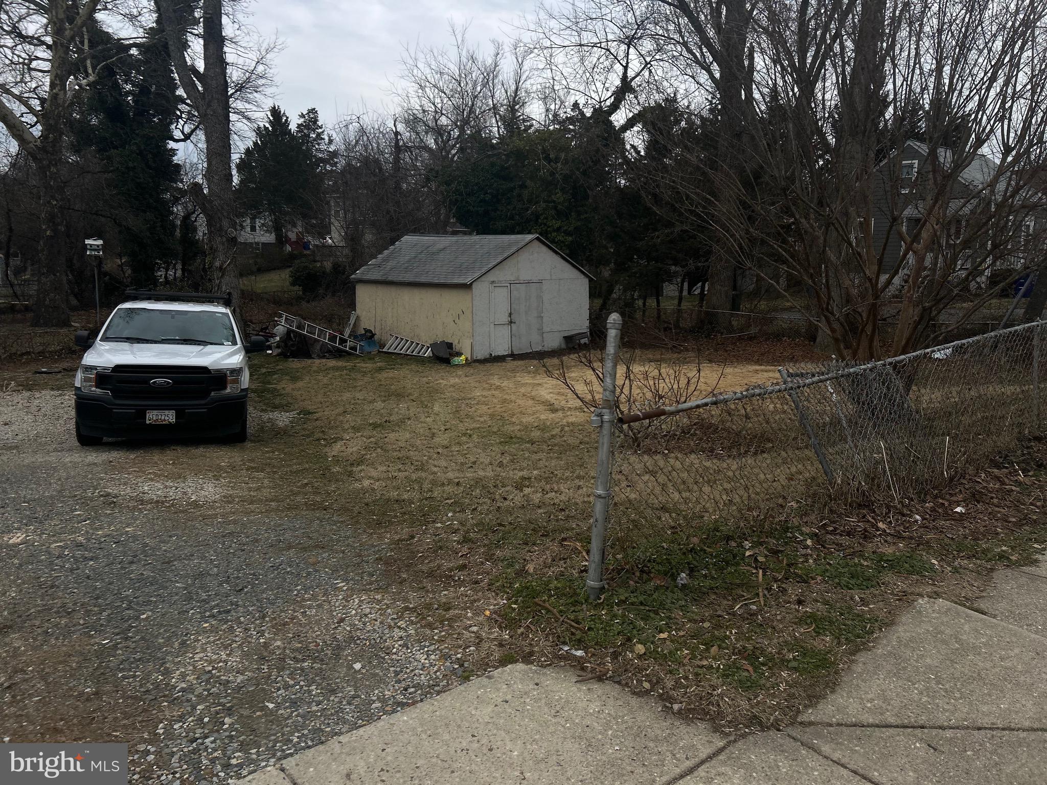 4410 Allies Road Suitland, MD 20746 - Photo 4 of 8 a car parked in front of a white house
