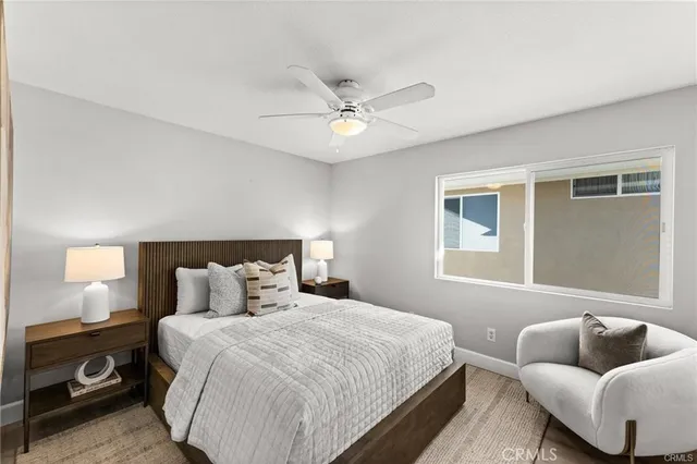 a bedroom with bed and a couch