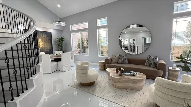 a living room with furniture and a large mirror