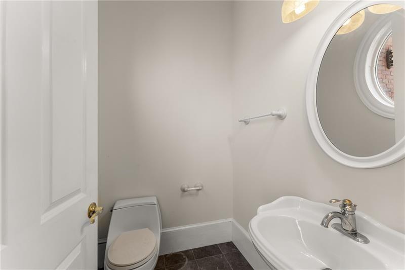 10 Club Court Alpharetta, GA 30005 - Photo 31 of 107 a bathroom with a sink a toilet and a mirror