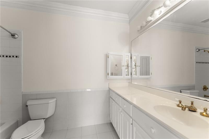 10 Club Court Alpharetta, GA 30005 - Photo 48 of 107 a bathroom with a granite countertop sink mirror vanity and toilet