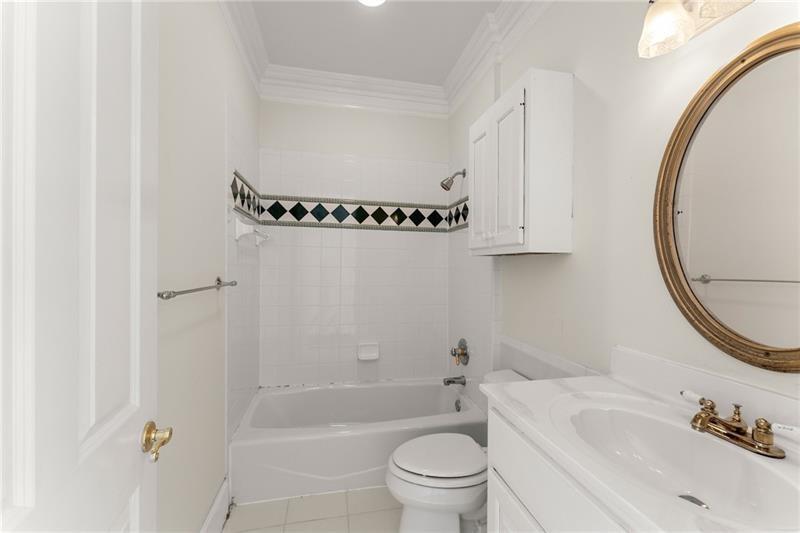 10 Club Court Alpharetta, GA 30005 - Photo 57 of 107 a bathroom with a sink and a mirror