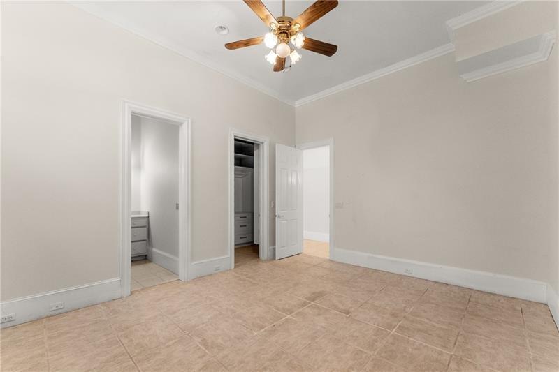 10 Club Court Alpharetta, GA 30005 - Photo 79 of 107 an empty room with closet and a ceiling fan