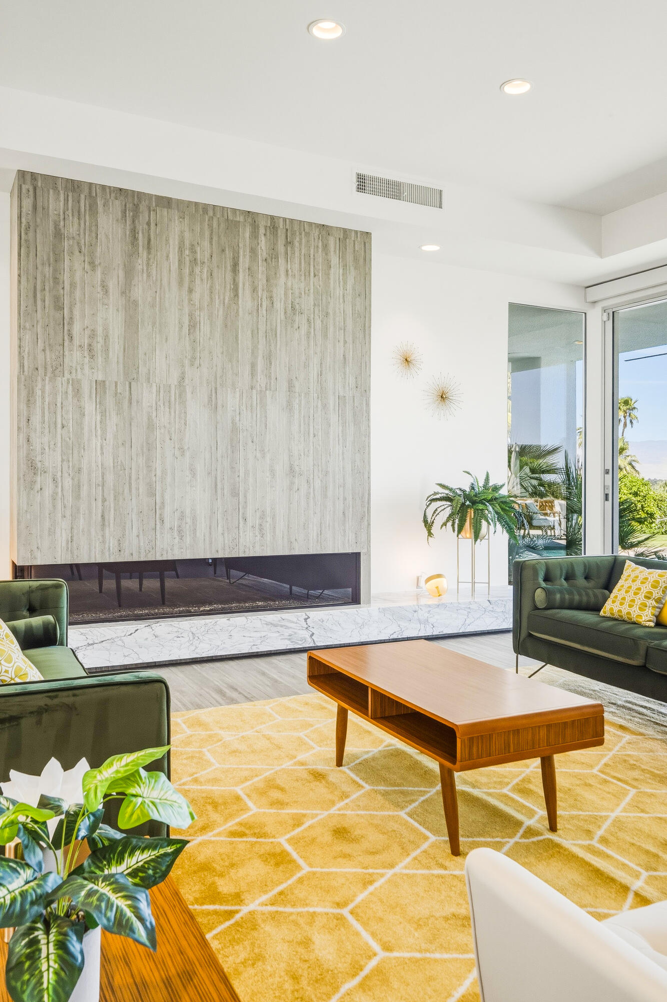 70288 Pecos Road Rancho Mirage, CA 92270 - Photo 12 of 69 a living room with patio furniture and a potted plant