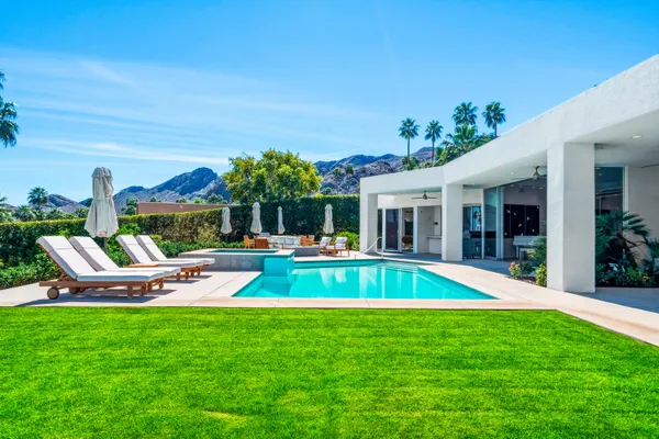 a view of a backyard with plants and garden