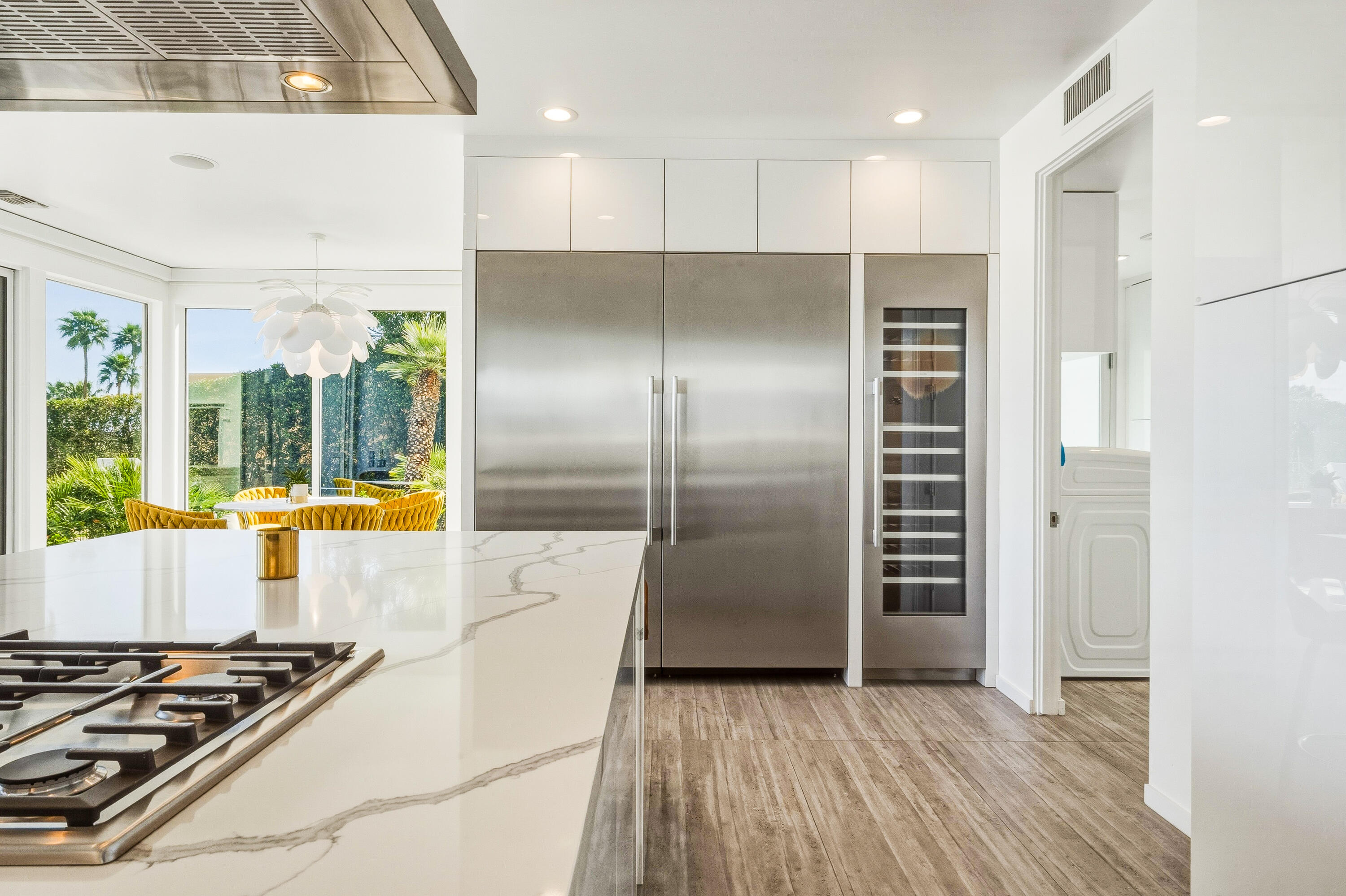 70288 Pecos Road Rancho Mirage, CA 92270 - Photo 21 of 69 a kitchen with stainless steel appliances a refrigerator a stove a sink and a large window