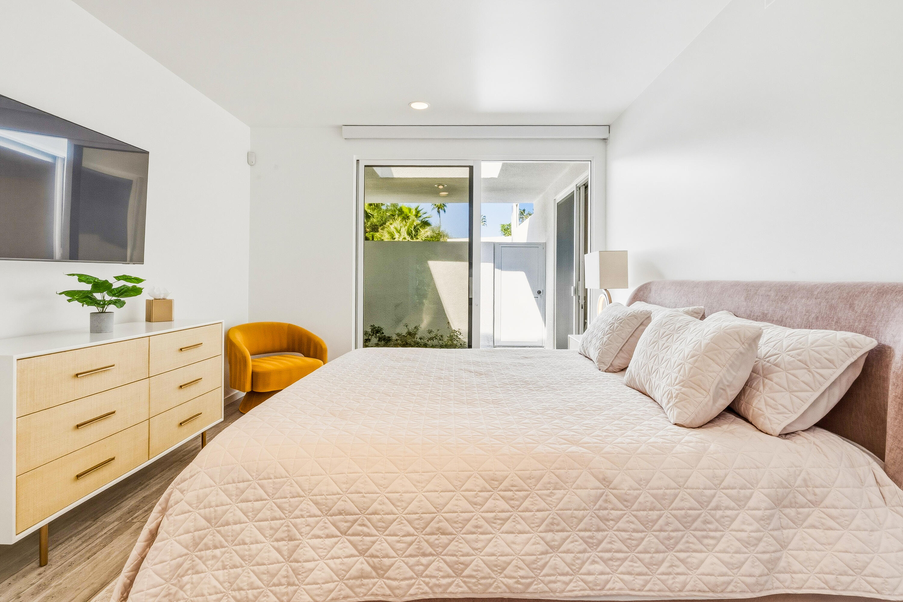 70288 Pecos Road Rancho Mirage, CA 92270 - Photo 28 of 69 a bedroom with a bed and window with lamp