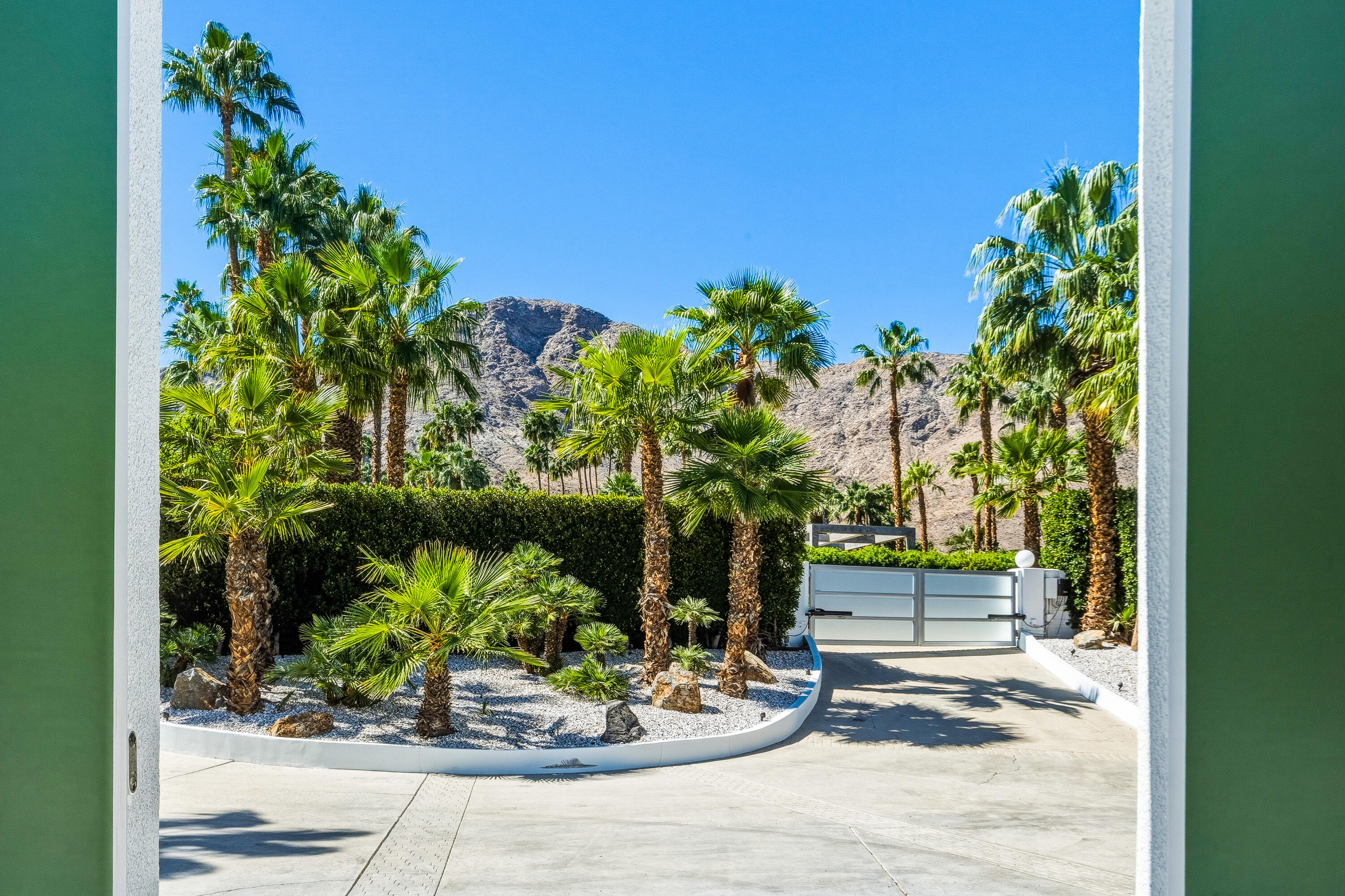 70288 Pecos Road Rancho Mirage, CA 92270 - Photo 5 of 69 a view of a backyard with plants and garden