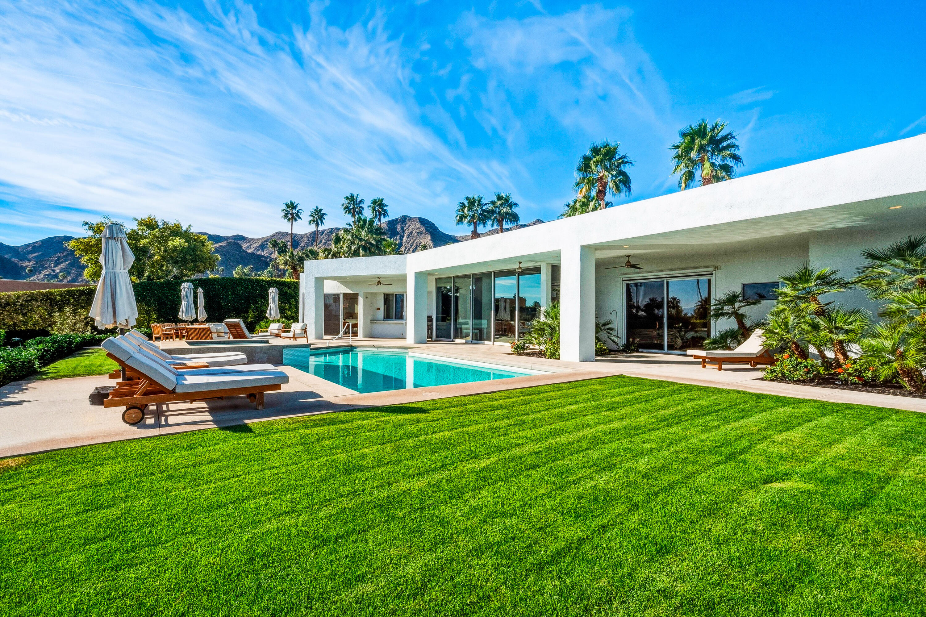 70288 Pecos Road Rancho Mirage, CA 92270 - Photo 55 of 69 a view of a house with a backyard porch and sitting area