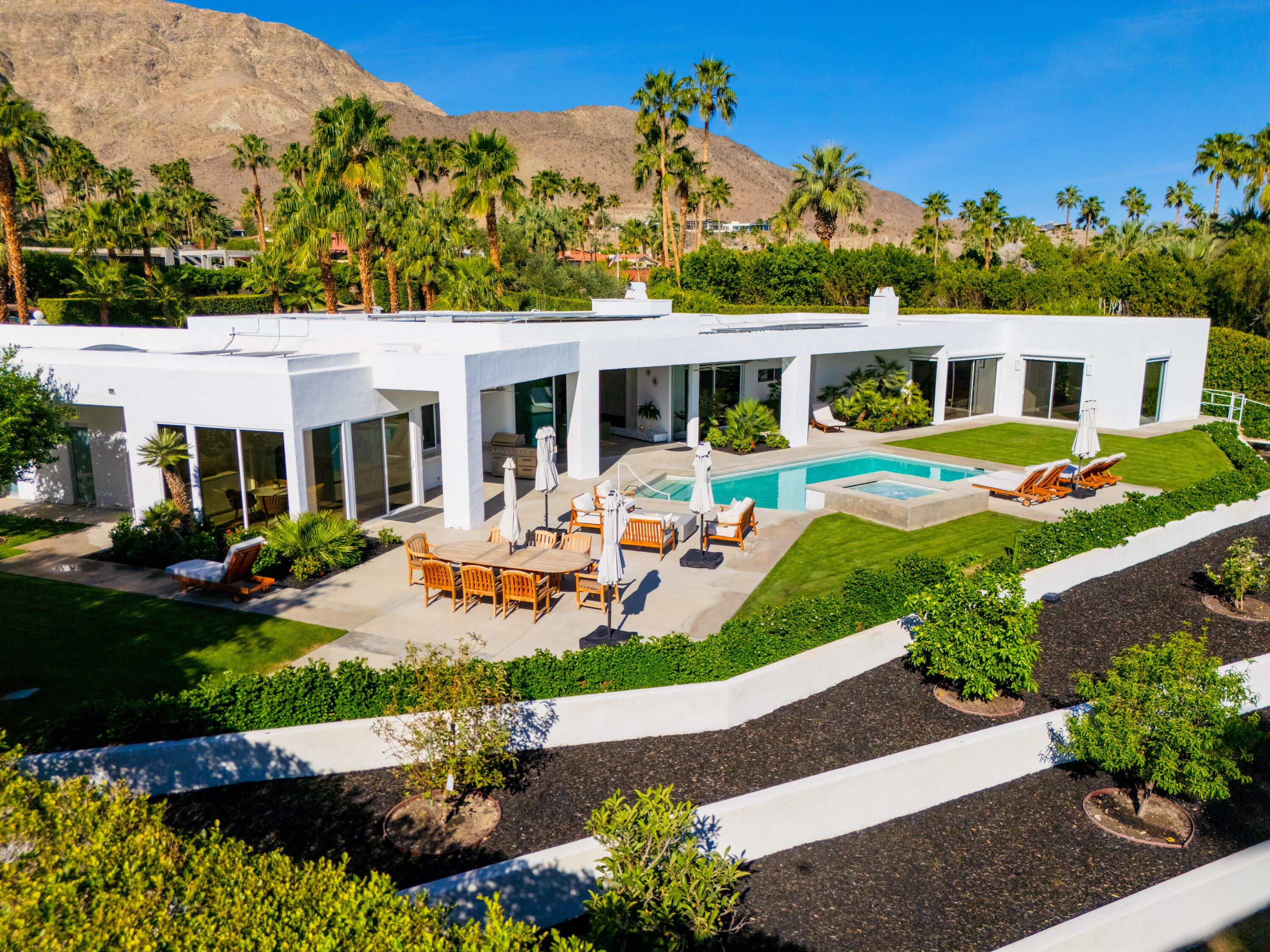 70288 Pecos Road Rancho Mirage, CA 92270 - Photo 62 of 69 a front view of a house with garden