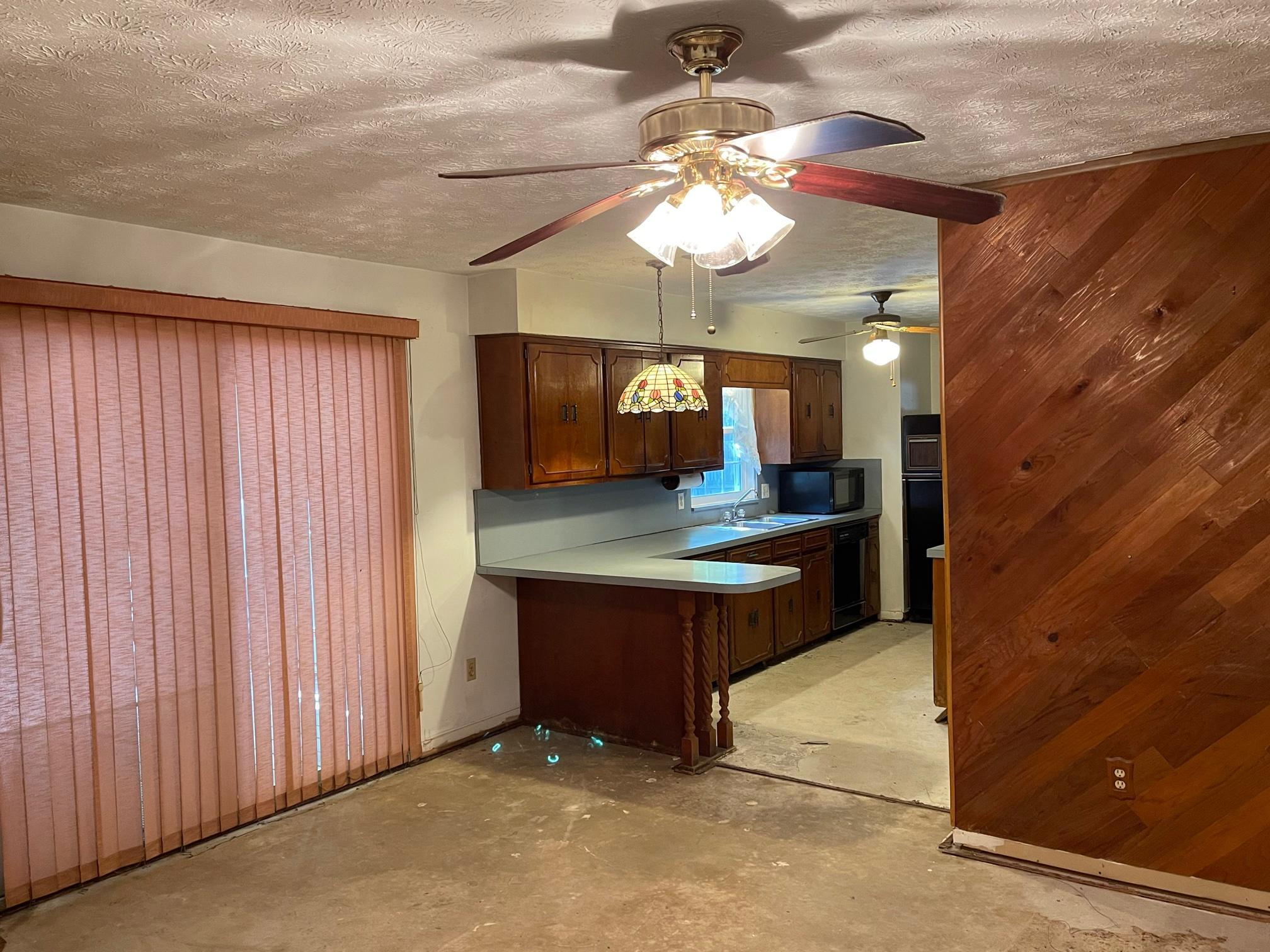 335 Wesley Road Green Cove Springs, FL 32043 - Photo 13 of 39 Living Room opens to kitchen