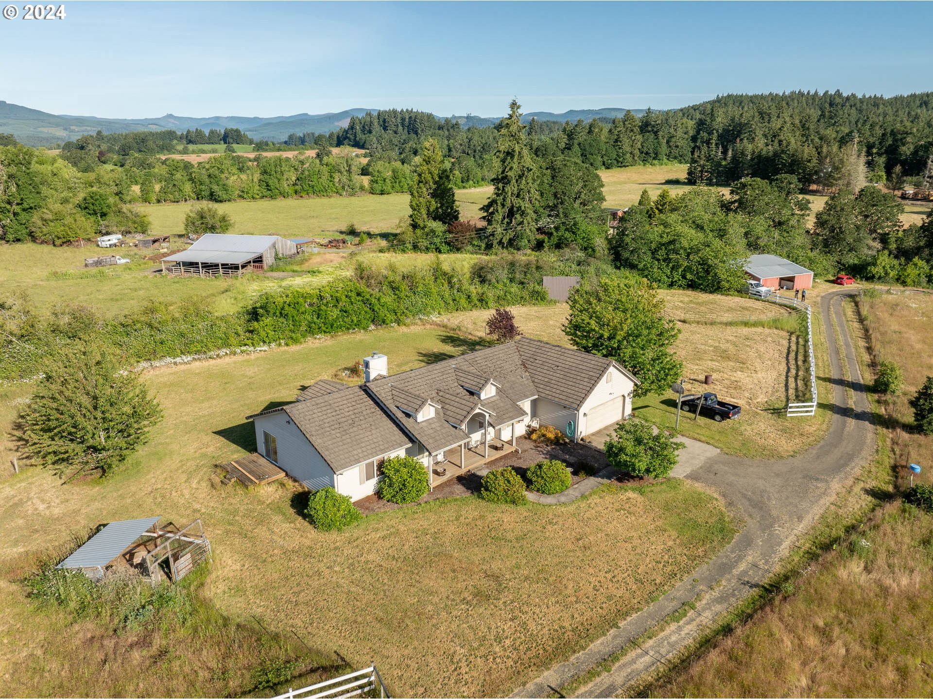 16500 Falls City Road Dallas, OR 97338 - Photo 1 of 36 an aerial view of a house with garden space and mountain view