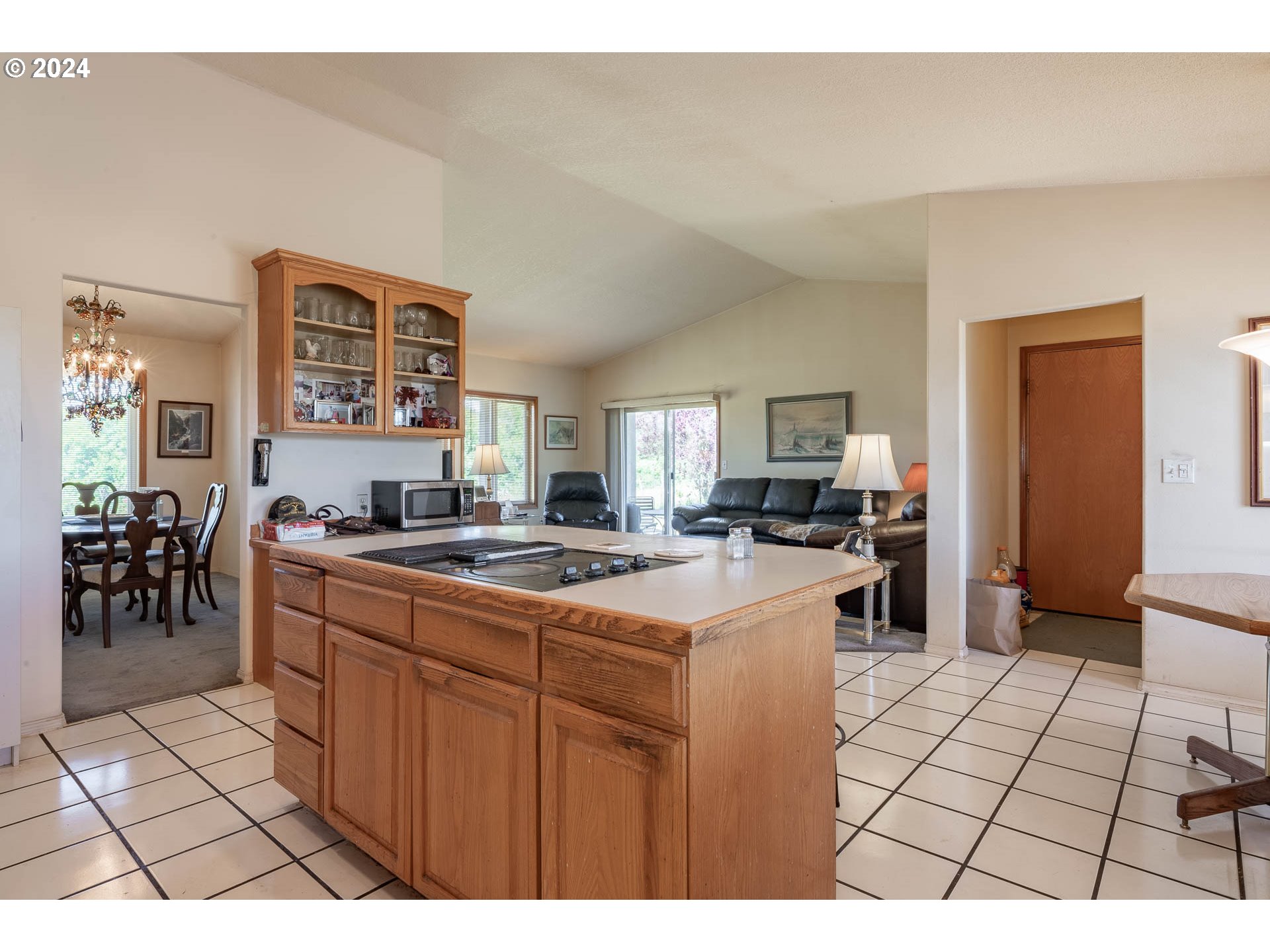 16500 Falls City Road Dallas, OR 97338 - Photo 11 of 36 a open kitchen with stainless steel appliances kitchen island granite countertop a refrigerator a stove a sink and dishwasher