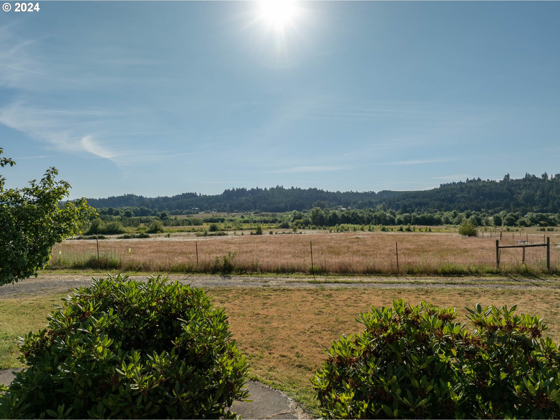 16500 Falls City Road Dallas, OR 97338 - Photo 3 of 36 a view of a lake with houses in the back