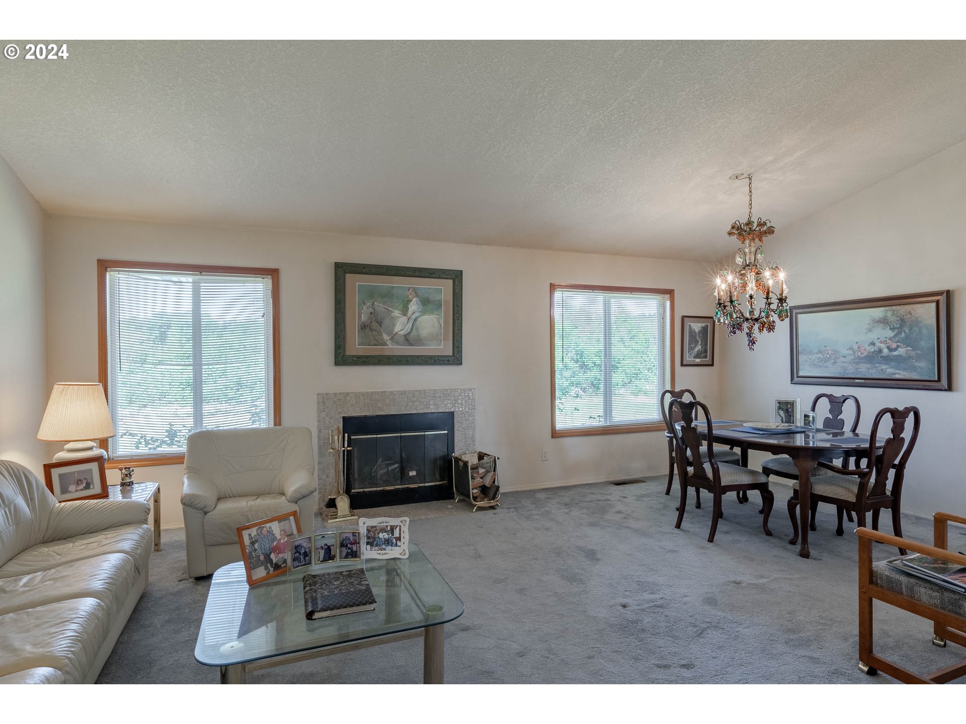 16500 Falls City Road Dallas, OR 97338 - Photo 6 of 36 a living room with furniture a window and a fireplace