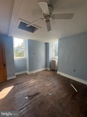 a bathroom with a bathtub and a window