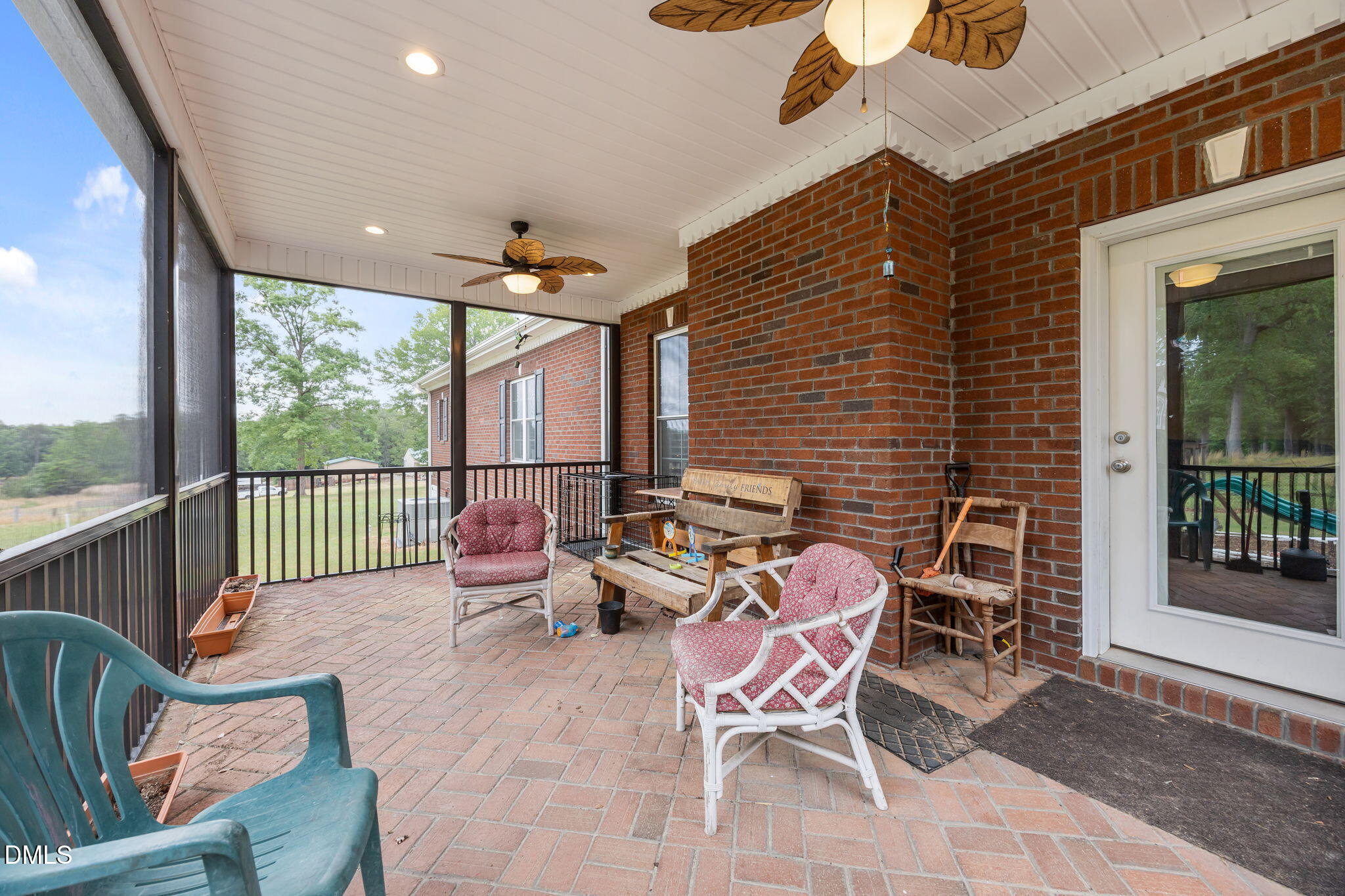2880 Elevation Road Four Oaks, NC 27524 - Photo 40 of 51 a balcony with furniture and a potted plant