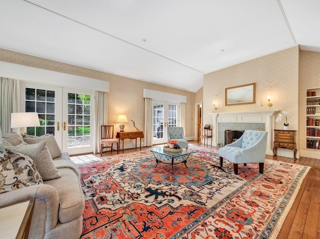 11 Sagamore Farm Road Hamilton, MA 01982 - Photo 8 of 34 a living room with furniture large window and a fireplace