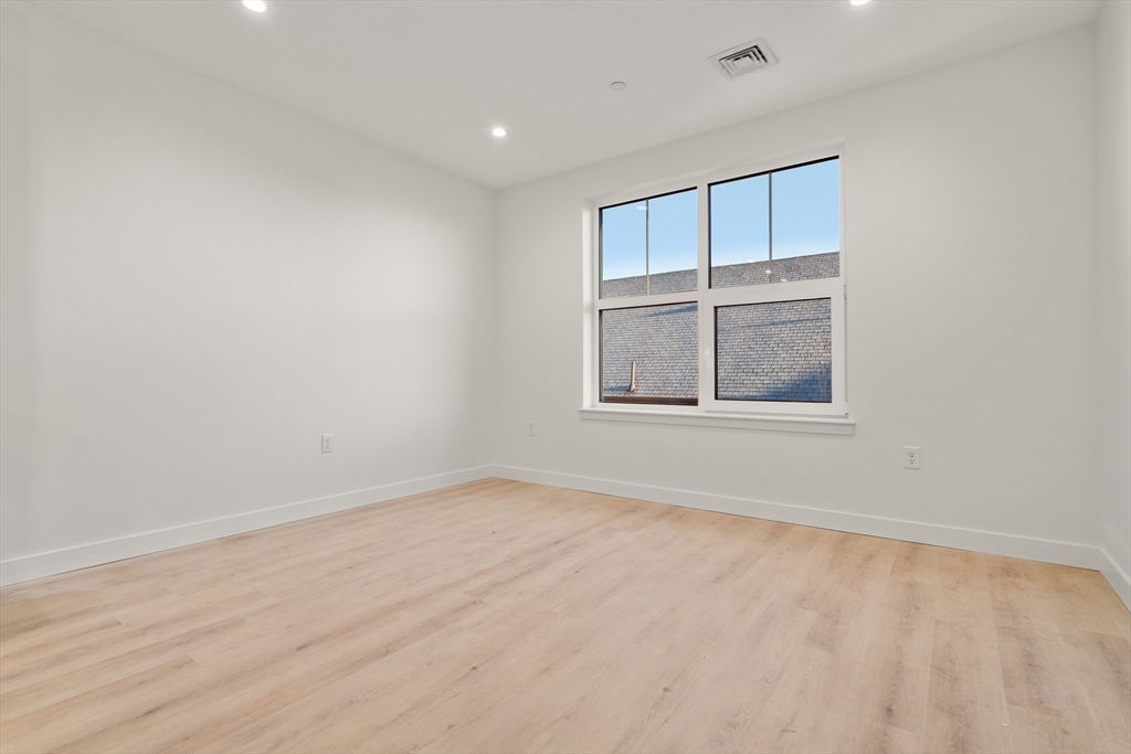 1151 Walnut Street, Unit 406 Newton, MA 02461 - Photo 16 of 32 an empty room with a window