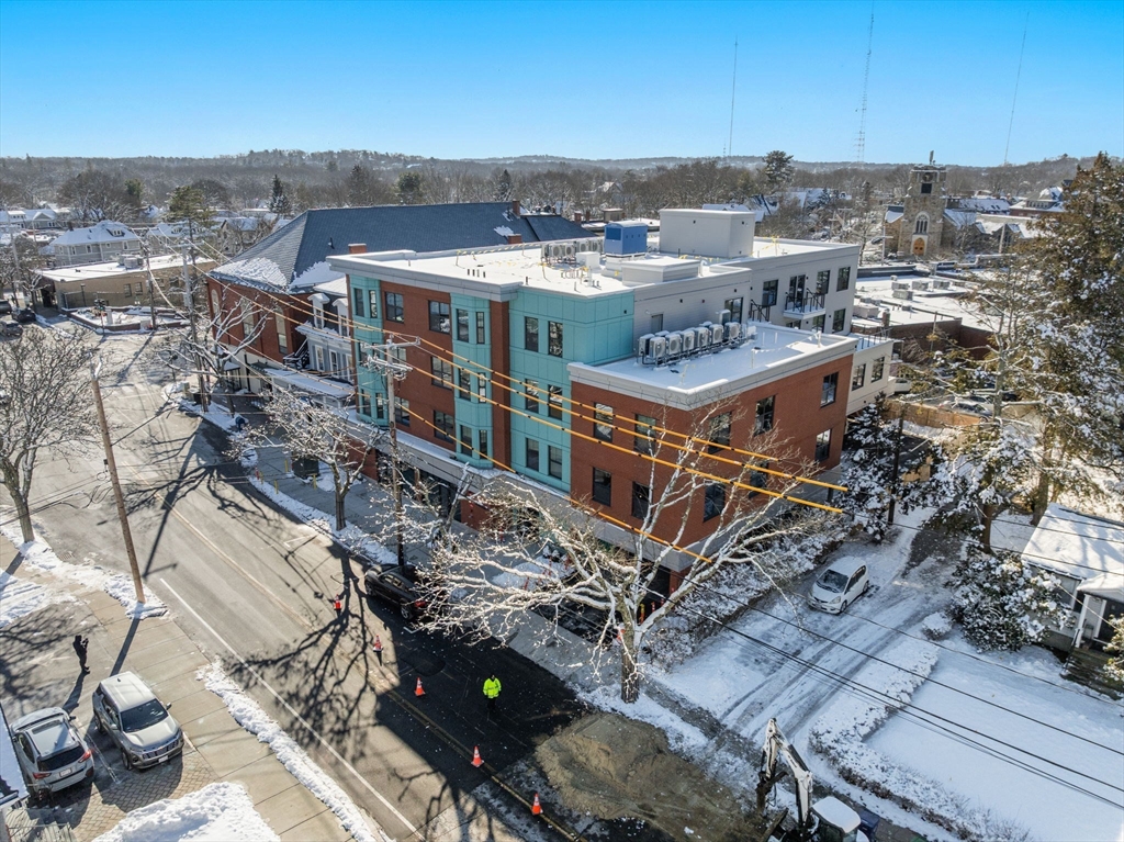 1151 Walnut Street, Unit 406 Newton, MA 02461 - Photo 22 of 32 an aerial view of a house with a yard
