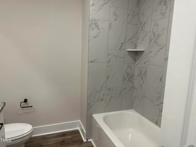 a bathroom with a sink and toilet