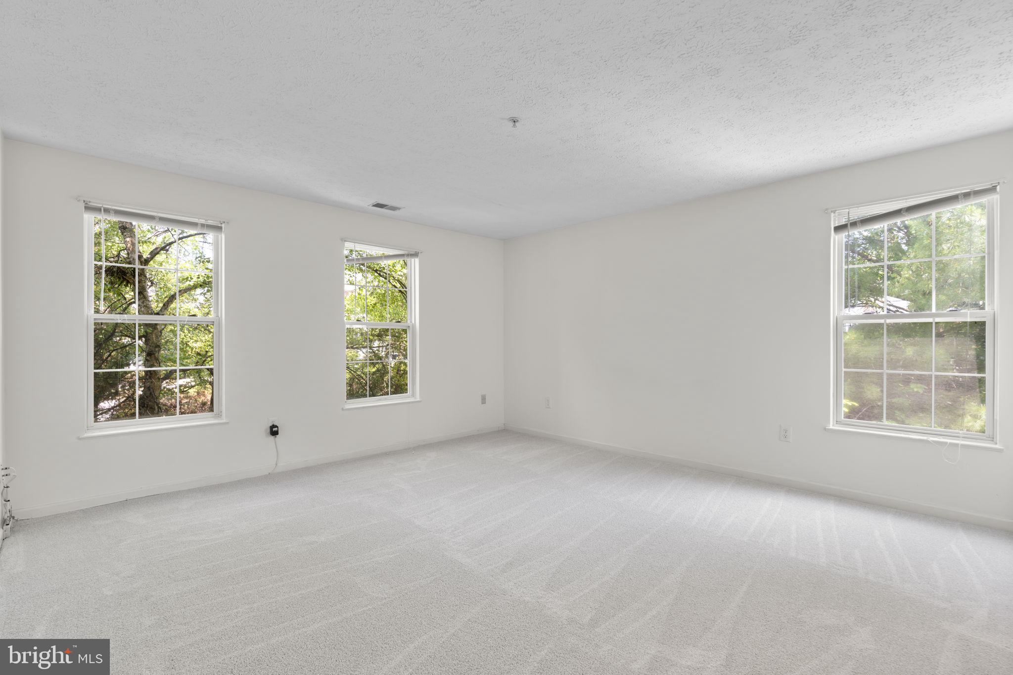 2444 Blue Spring Court, Unit 203 Odenton, MD 21113 - Photo 18 of 36 an empty room with windows