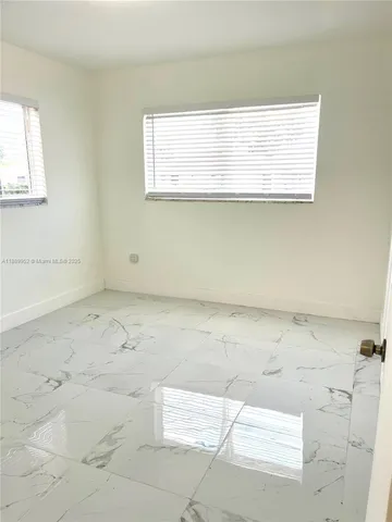 a view of a window in an empty room