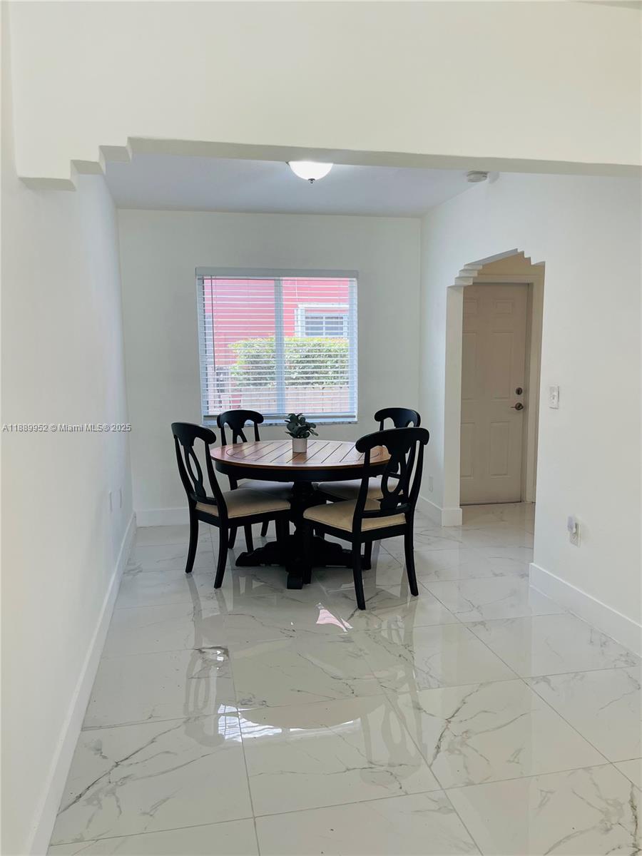 3175 Southwest 27th Terrace, Unit 3175 Miami, FL 33133 - Photo 6 of 17 a work room with furniture and window