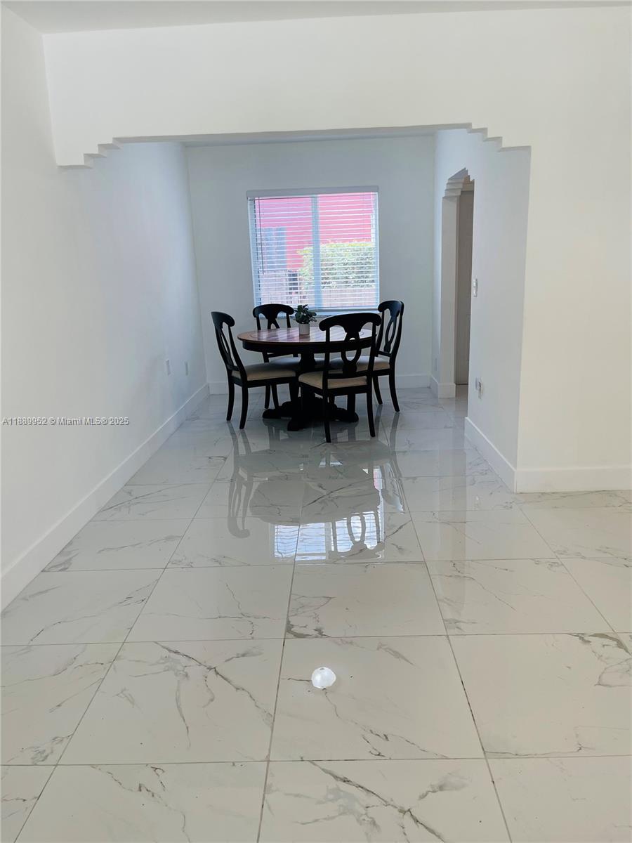 3175 Southwest 27th Terrace, Unit 3175 Miami, FL 33133 - Photo 8 of 17 a room with furniture and window