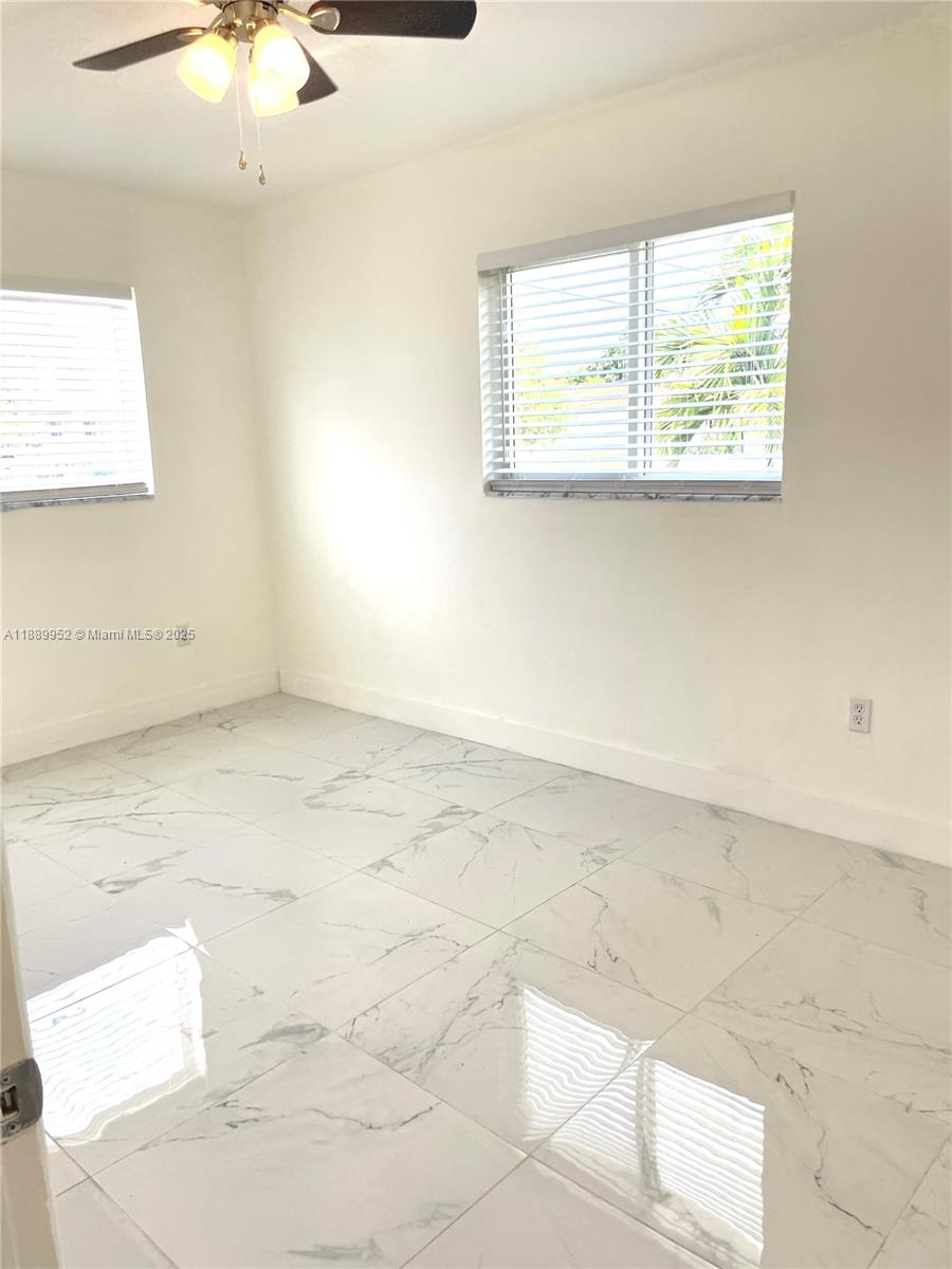 3175 Southwest 27th Terrace, Unit 3175 Miami, FL 33133 - Photo 10 of 17 a view of a room that has a window in it
