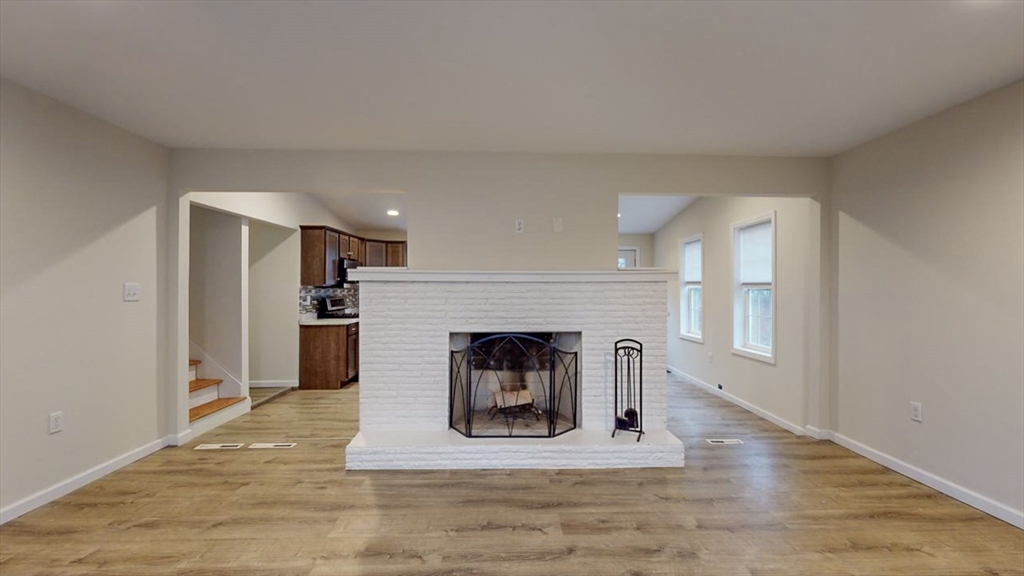 195 Riverton Road Springfield, MA 01109 - Photo 15 of 42 a living room with furniture and a fireplace